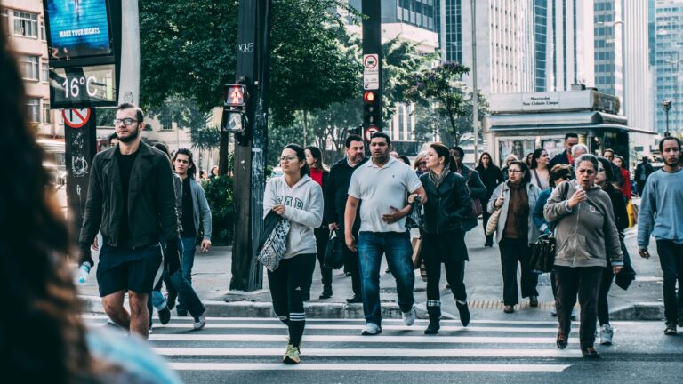 people crossing a busy street